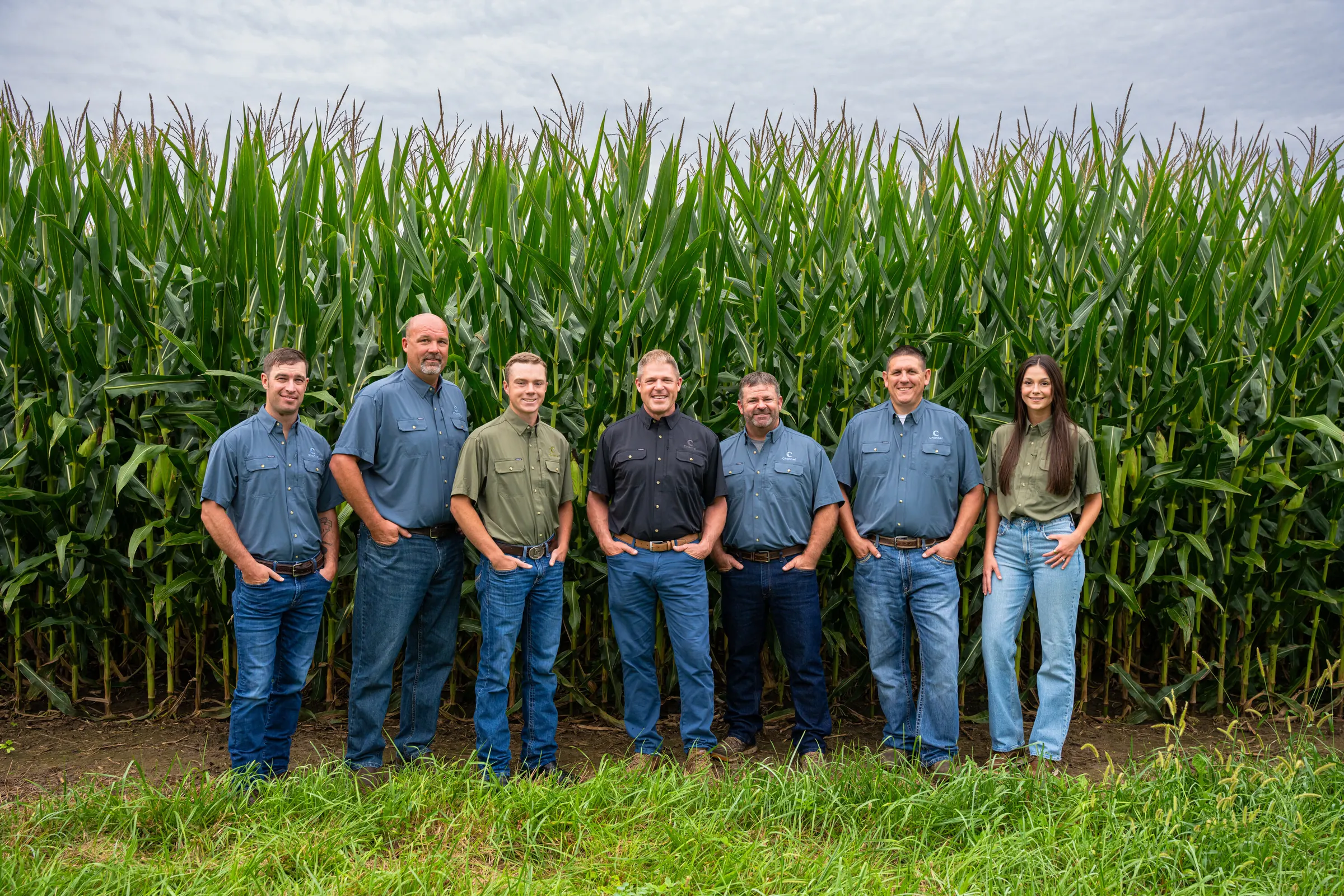 Indiana Specialty Group together beside a corn field